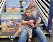 Our Partnership Officer, Brian Haworth, with one of his grandsons enjoying the display.