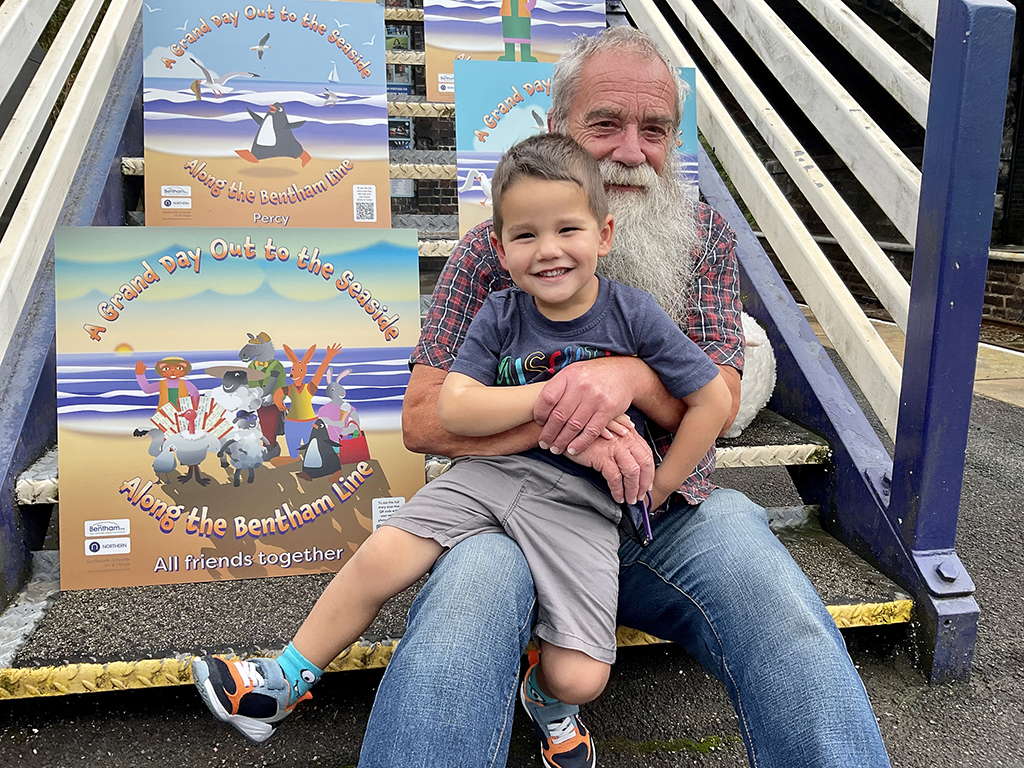 Our Partnership Officer, Brian Haworth, with one of his grandsons enjoying the display.